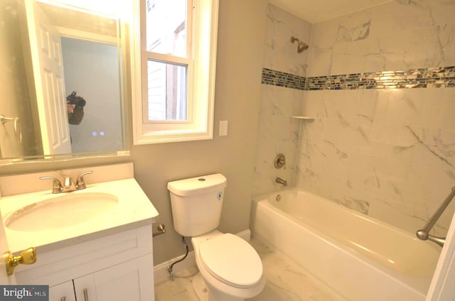 full bathroom with toilet, vanity, and tiled shower / bath combo