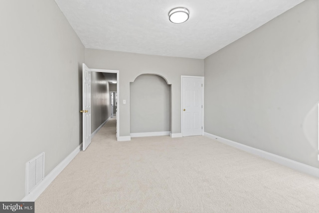 unfurnished bedroom with light carpet