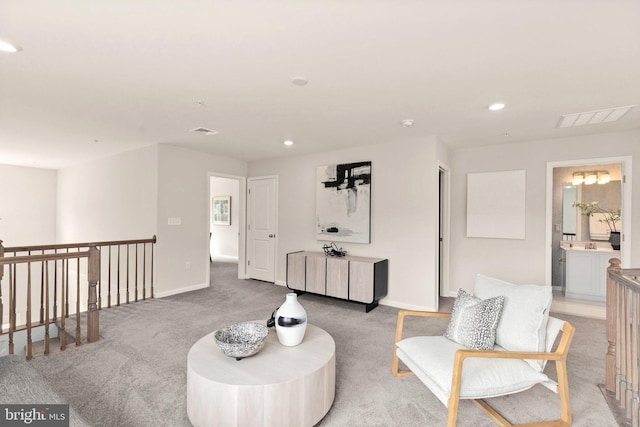 sitting room with light colored carpet