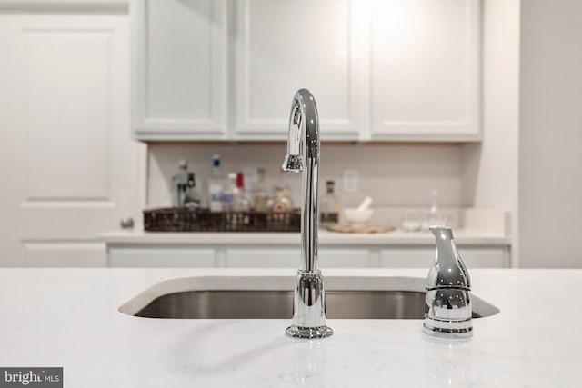 room details with sink and white cabinetry