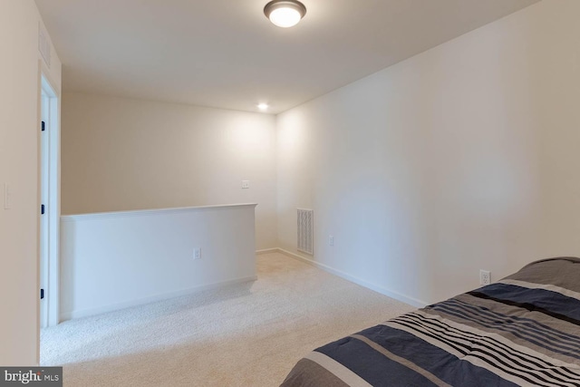 bedroom with light carpet