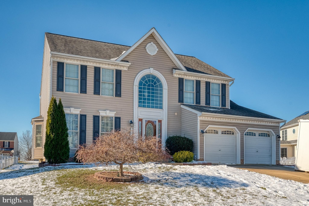 view of front of property with a garage