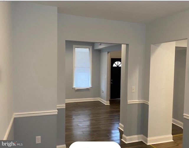 spare room with dark hardwood / wood-style flooring