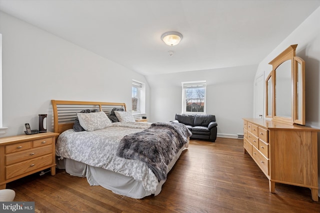 bedroom with dark wood-style floors