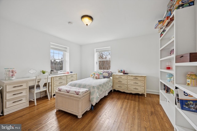 bedroom with hardwood / wood-style floors