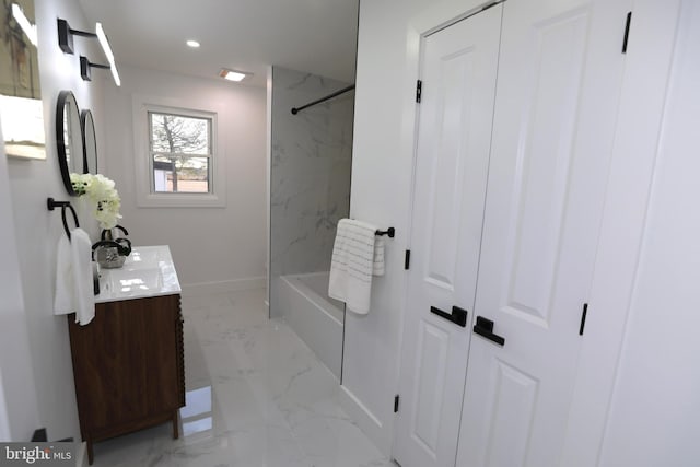 bathroom featuring shower / bathtub combination and vanity