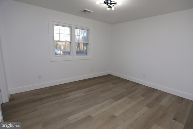 empty room with hardwood / wood-style floors