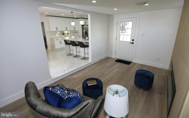 foyer entrance with light wood-type flooring