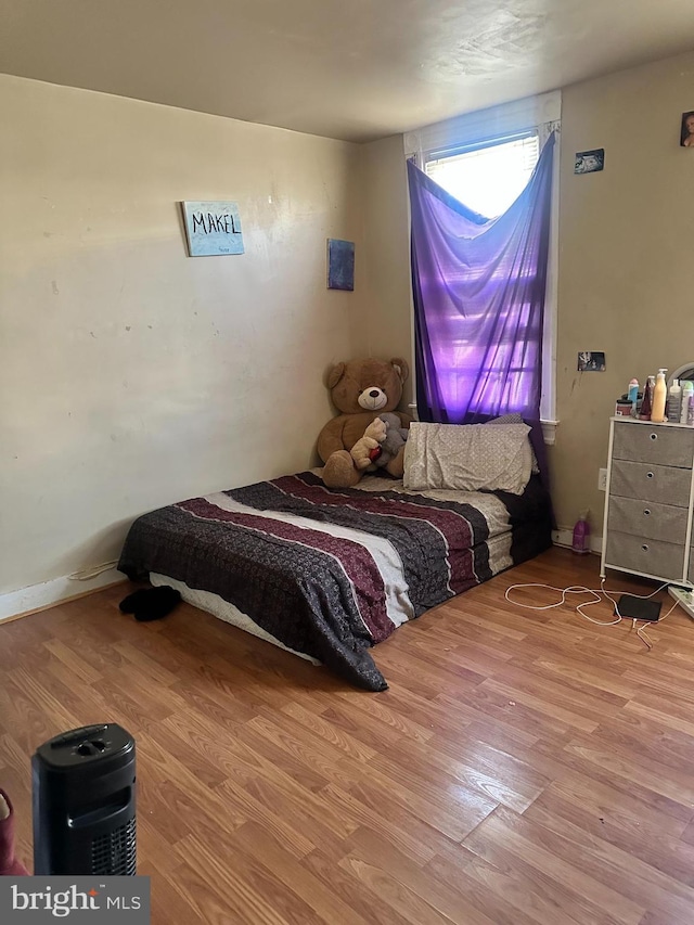 bedroom with wood-type flooring