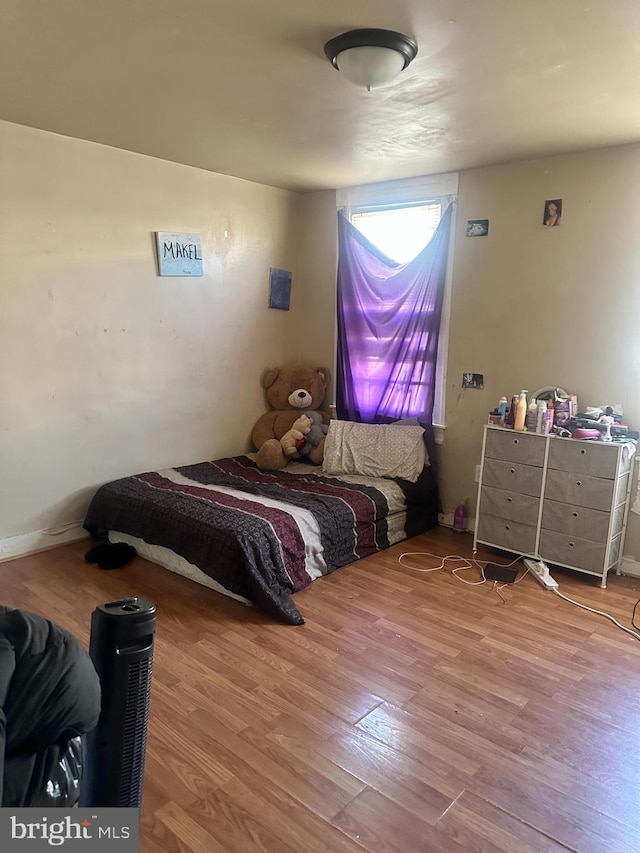 bedroom featuring hardwood / wood-style flooring