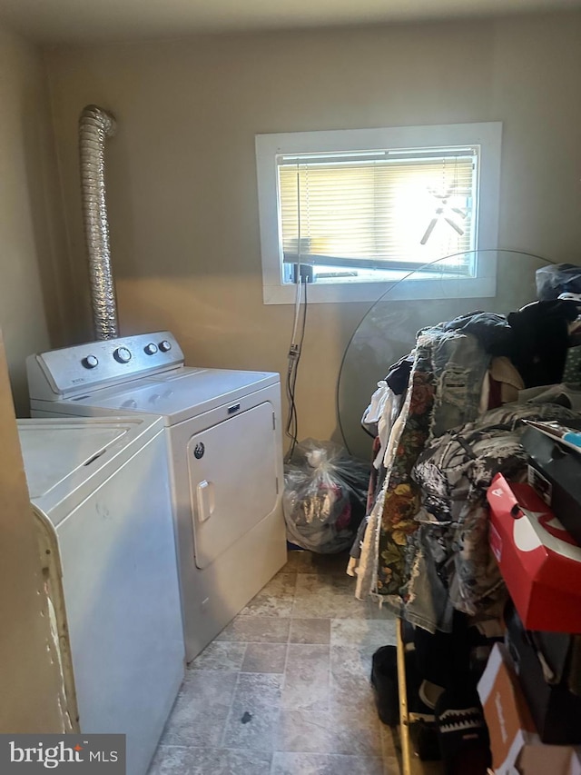 washroom featuring washer and dryer