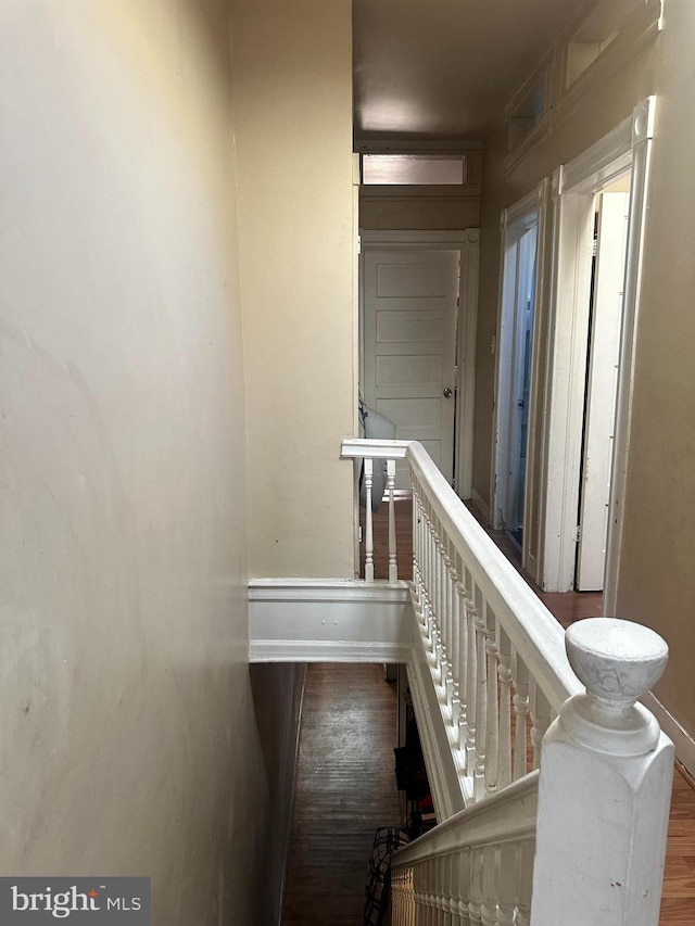 hallway featuring wood-type flooring