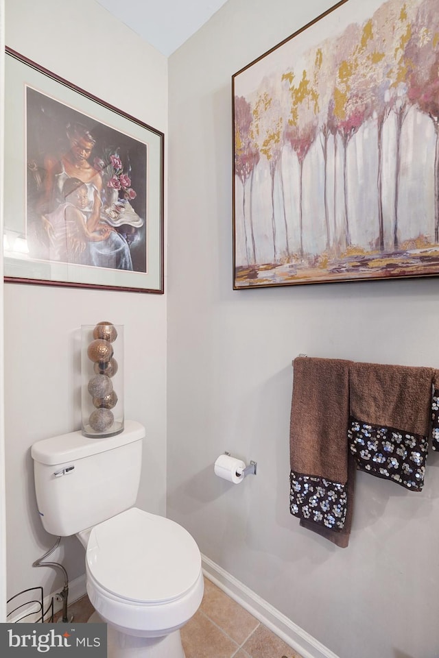 bathroom with tile patterned floors and toilet