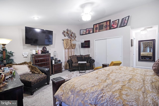 bedroom featuring light colored carpet