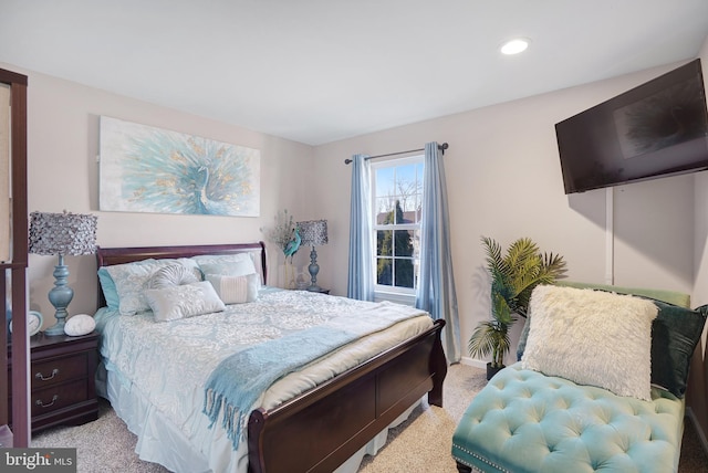 bedroom featuring light carpet