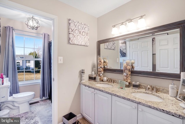 bathroom featuring vanity and toilet