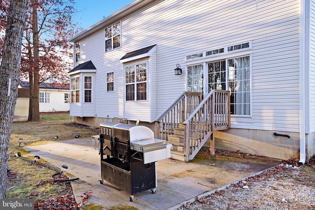 back of property featuring a patio