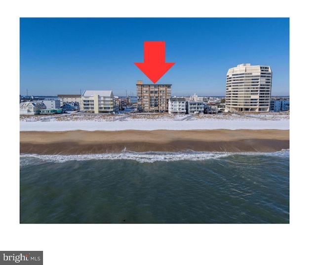 bird's eye view with a beach view and a water view