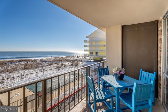 balcony with a view of the beach and a water view