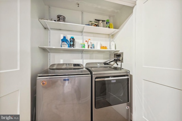 laundry room featuring washer and clothes dryer