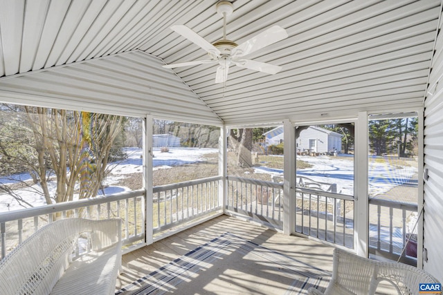 sunroom with lofted ceiling and ceiling fan