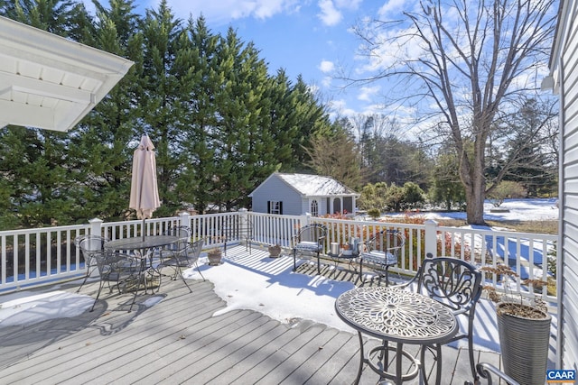 wooden deck featuring an outdoor structure