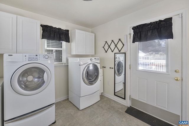 laundry room with cabinets and independent washer and dryer