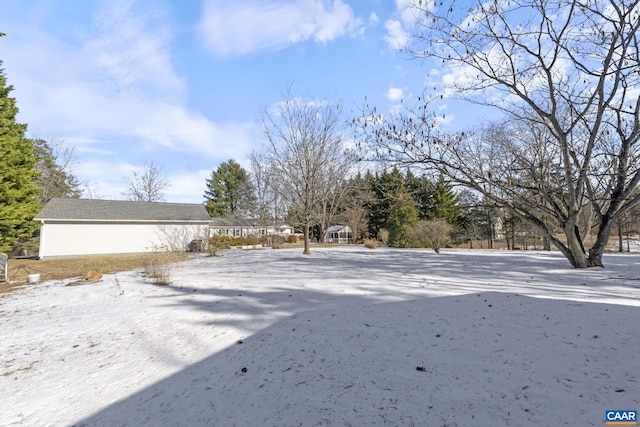 view of yard covered in snow