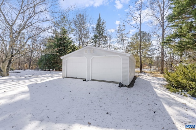 view of snow covered garage