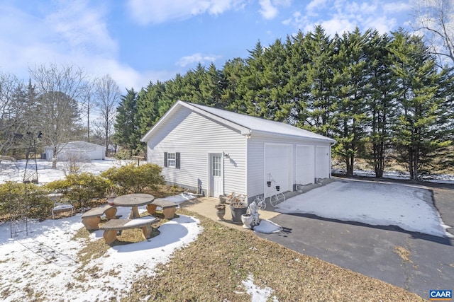 view of snow covered garage