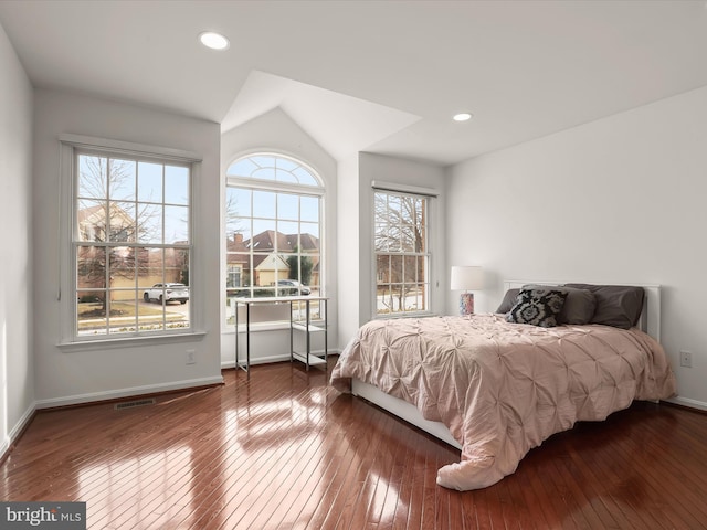 bedroom featuring dark wood-type flooring, recessed lighting, visible vents, and baseboards