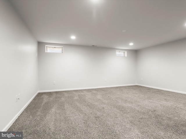 below grade area with carpet, baseboards, and recessed lighting