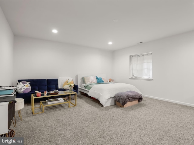 carpeted bedroom featuring recessed lighting and baseboards