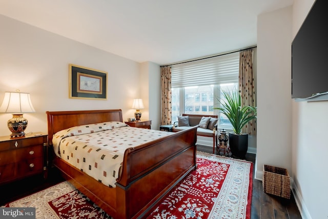 bedroom featuring dark hardwood / wood-style flooring