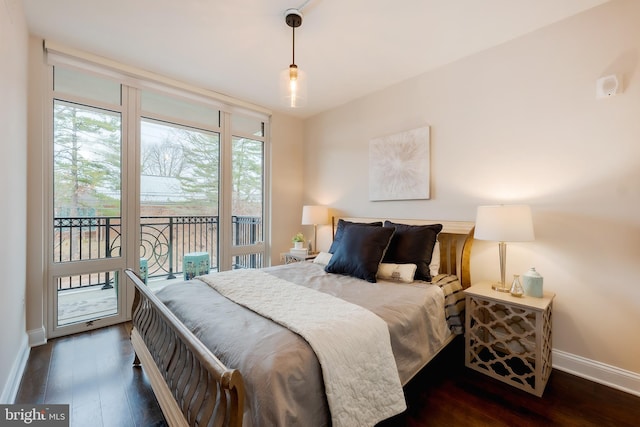 bedroom with dark hardwood / wood-style flooring and access to outside