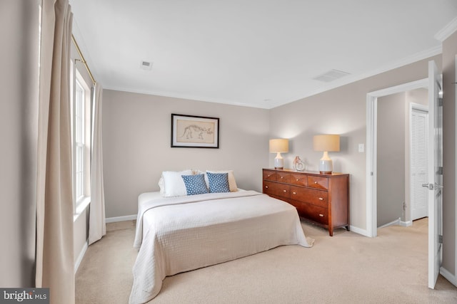 carpeted bedroom featuring crown molding