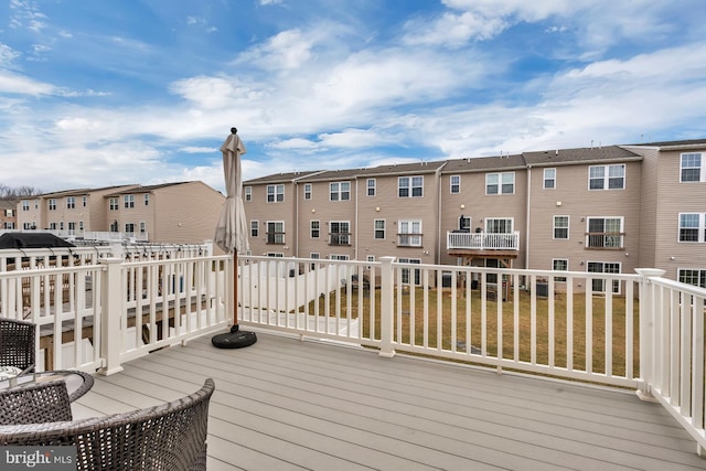 wooden deck with a yard