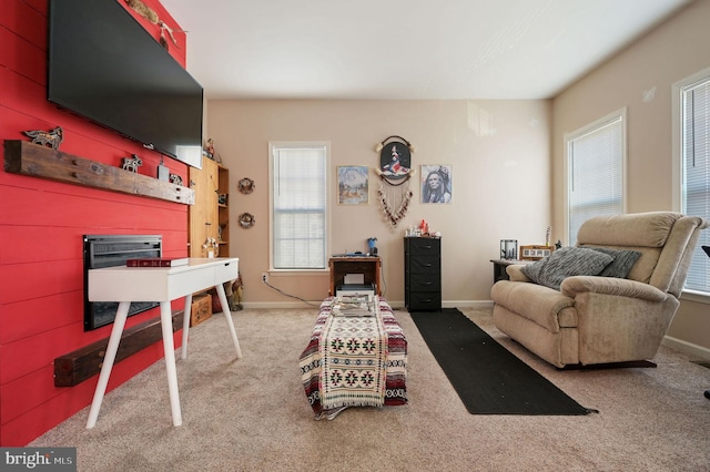 living room featuring light carpet and wooden walls