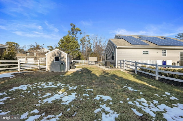 view of yard with a storage unit