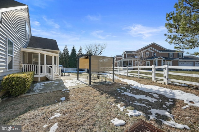 view of yard featuring a sunroom