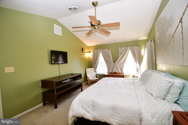 carpeted bedroom featuring vaulted ceiling and ceiling fan