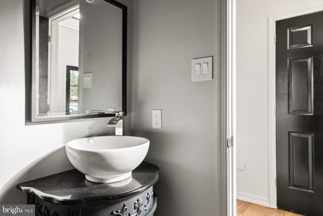 bathroom featuring vanity and hardwood / wood-style floors