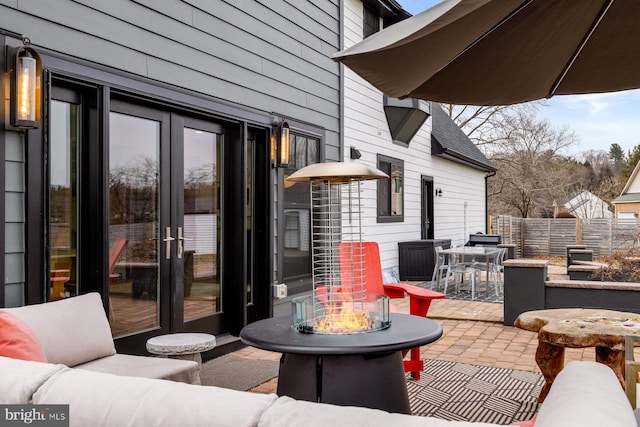 view of patio / terrace with an outdoor fire pit and french doors