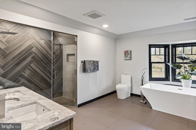 full bathroom featuring vanity, toilet, and shower with separate bathtub