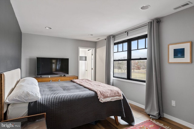 bedroom featuring light hardwood / wood-style floors