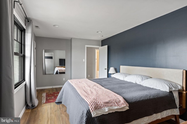 bedroom with light hardwood / wood-style flooring