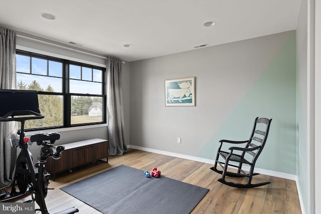 exercise area featuring light wood-type flooring