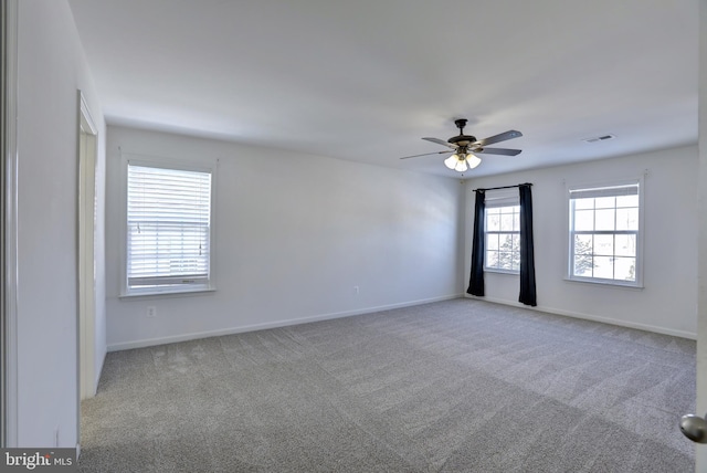 empty room with carpet and ceiling fan