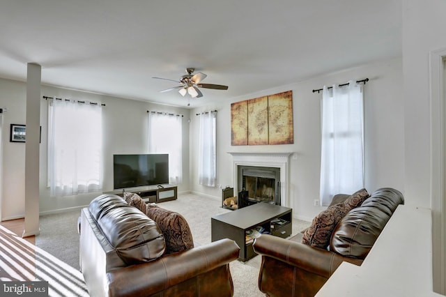 living room featuring light carpet and ceiling fan