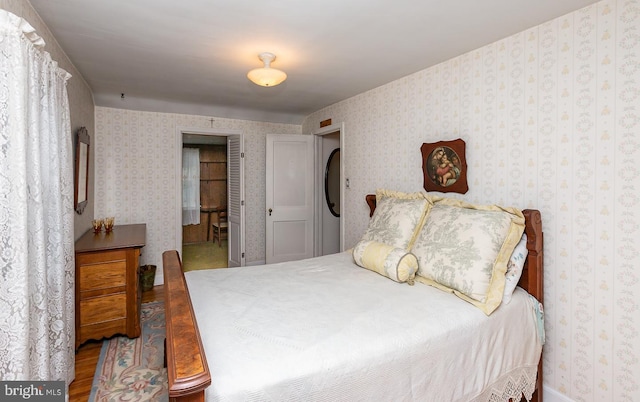 bedroom with hardwood / wood-style floors